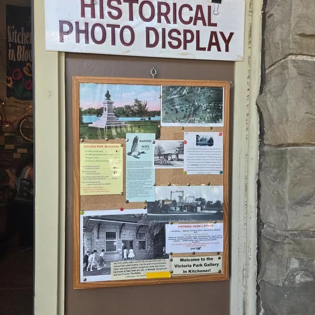 Cork board under a "Historical Photo Display" sign with old photos of Victoria Park, souvenir prices and a gallery welcome note.