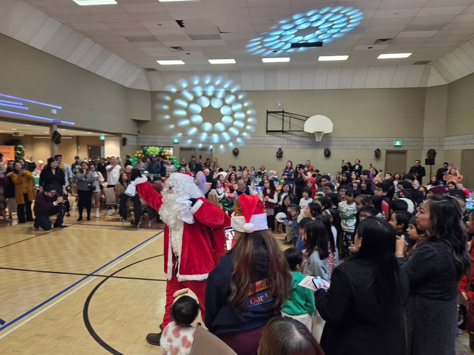 What an incredible night, the music, the dancing, the gifts for the kids, and the FOOD! Even a surprise visit from Santa.